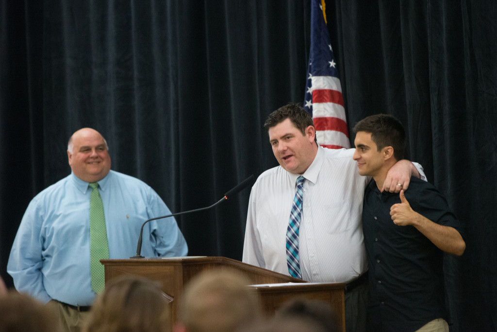 Jason Thompson congratulations Zach Tatoian as director Chuck Clark looks on during The Spring 2015 Student Publications End of the Year Dinner at the Augenstein Alumni Center on May 8th, 2014.