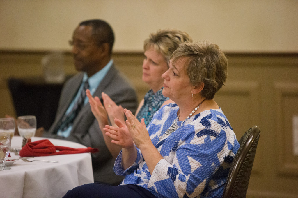 Tracy Newton, Sherry West, and Richard Miller listen during the Spring 2015 Student Publications End of the Year Dinner at the Augenstein Alumni Center on May 8th, 2014.